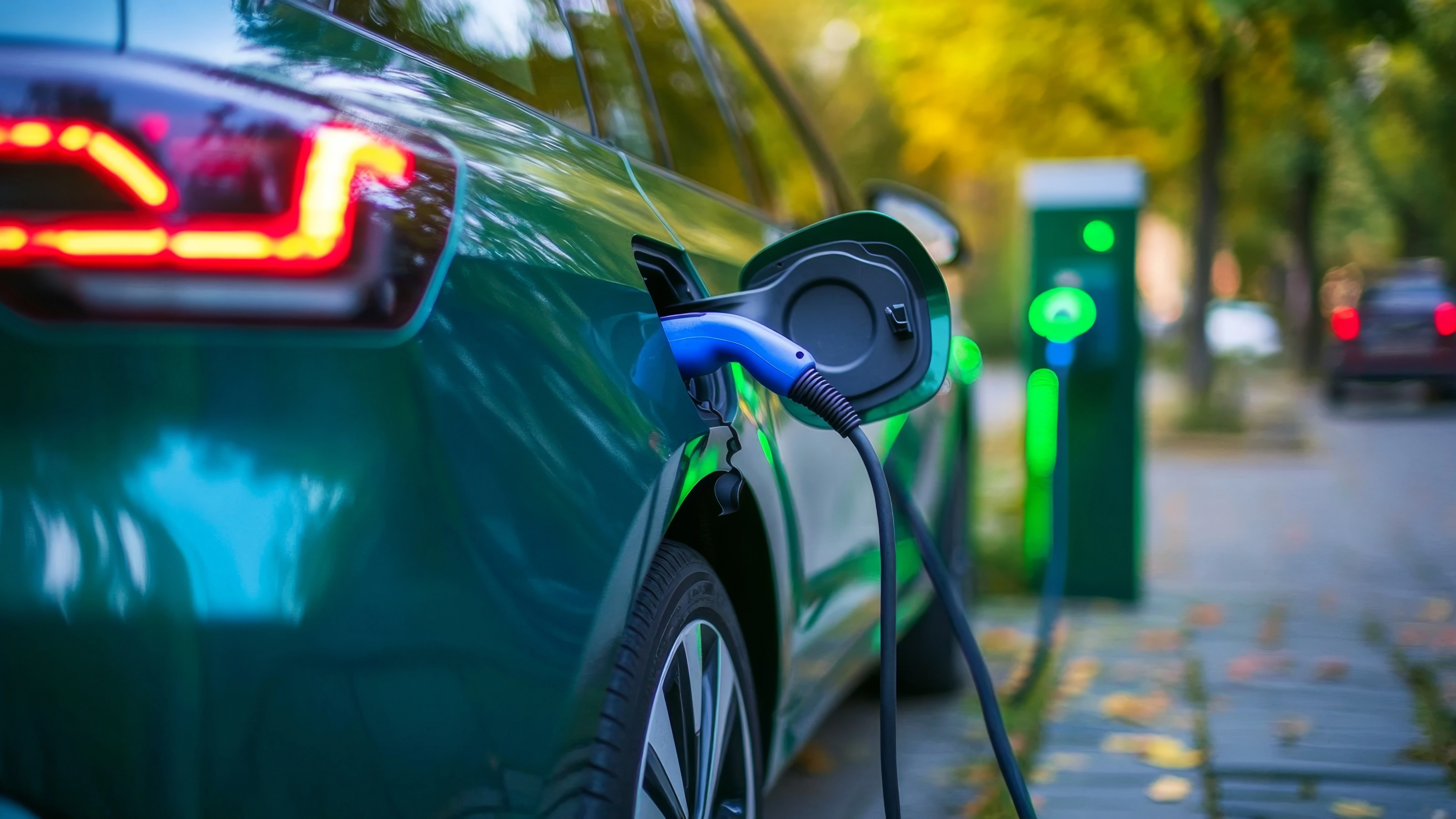 An electric car is being charged at a charging station.