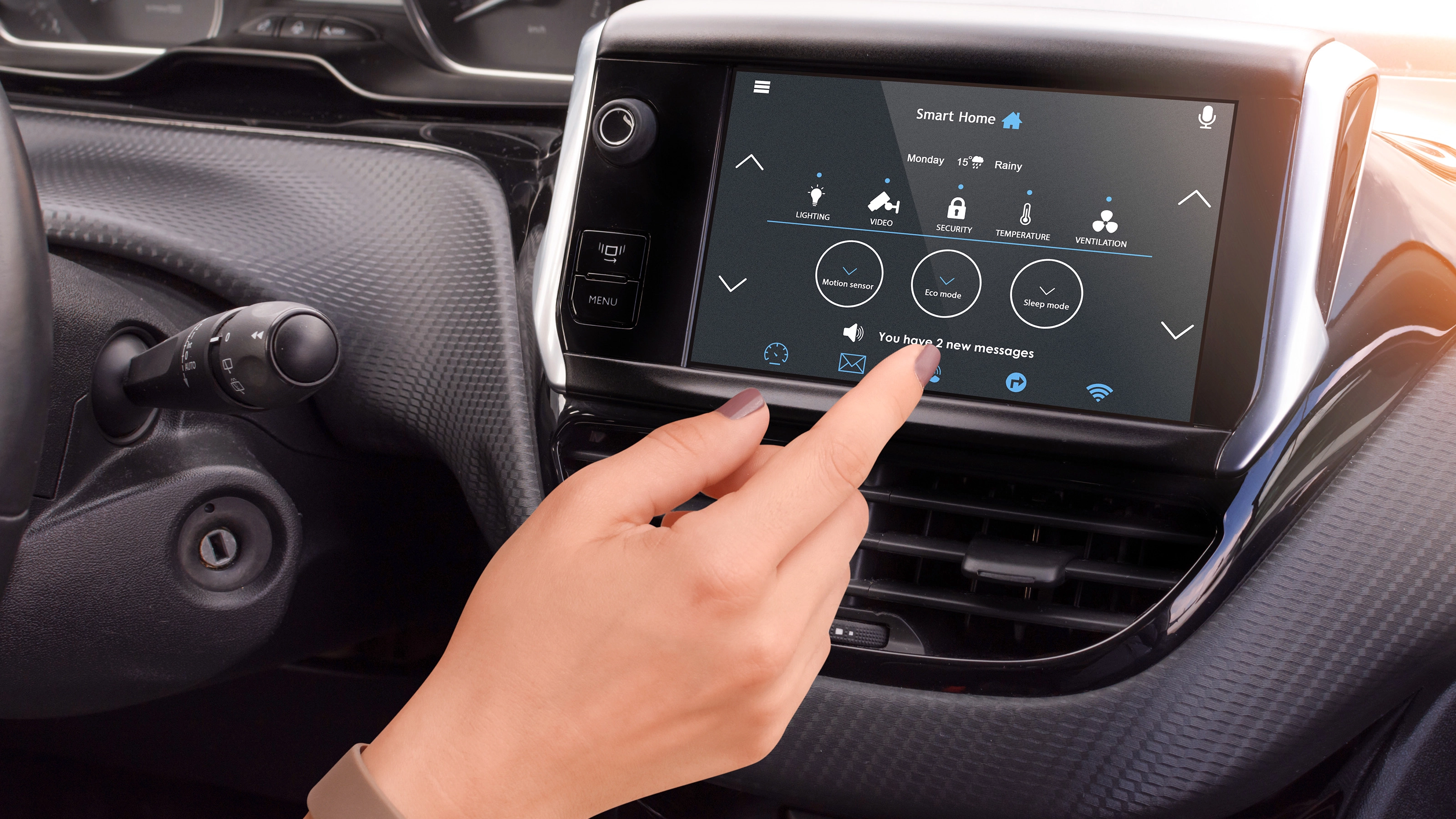 Hand touching a smart home control screen in a car dashboard.